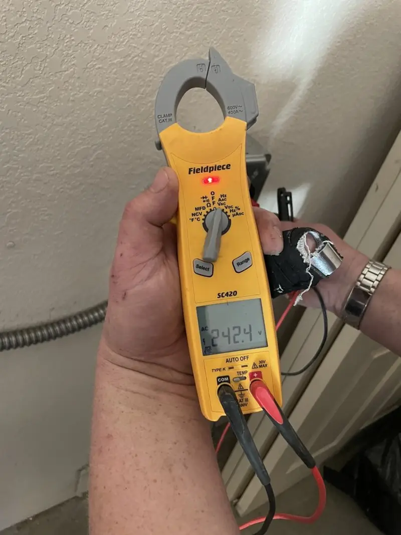 Voltage testing with clamp meter during Whole House Surge Protector in McDonough